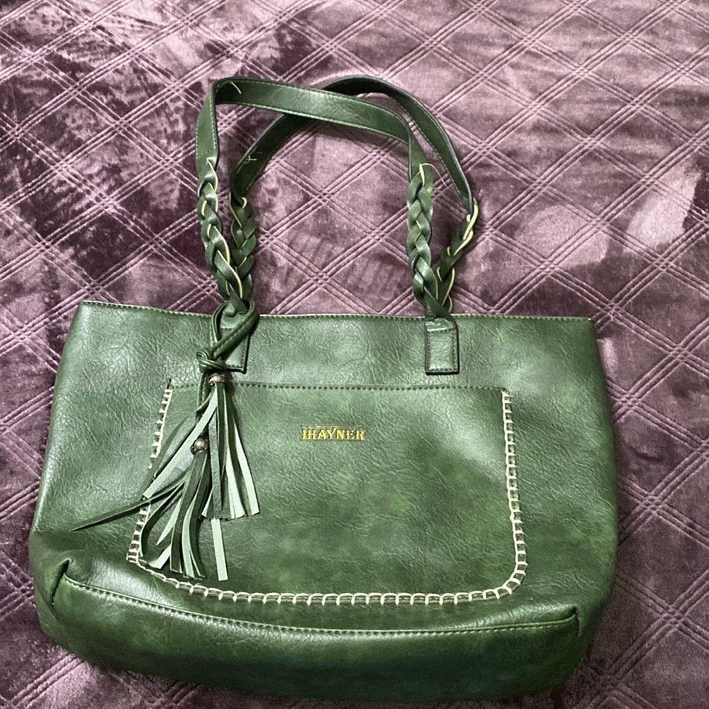 Green vegan leather tote bag. Braided straps w/outside pocket. Very roomy.